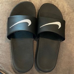 Nike slides- size 8. Great condition with minimal wear on soles Lots o life left